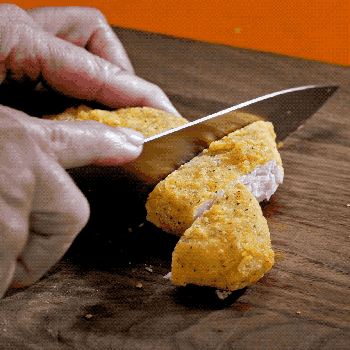 A video of someone cutting the meati classic cutlet into slices